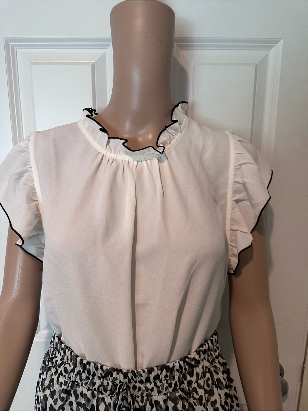 LOFT Outlet Mock Neck Flutter Sleeve Blouse in White with Black Trim  size L